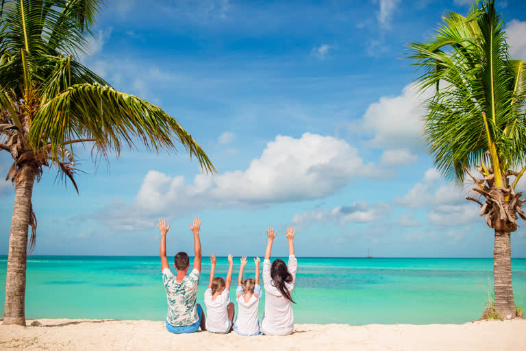 Happy family on a tropical beach