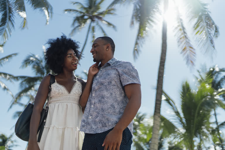 Happy couple in a tropical setting